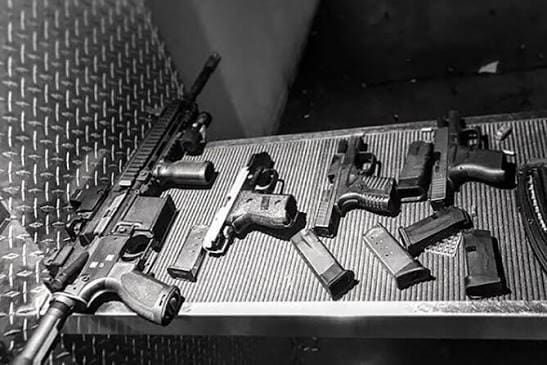 Handguns and rifle on the dealer counter at Hammond Tactical, licensed gun dealer in Hammond, Indiana