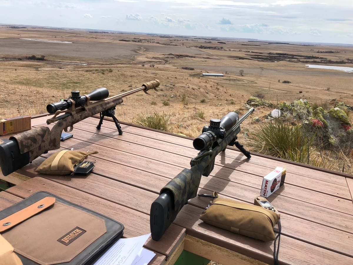 Precision bolt-action rifles with long-range optics on a shooting bench — special orders at Hammond Tactical